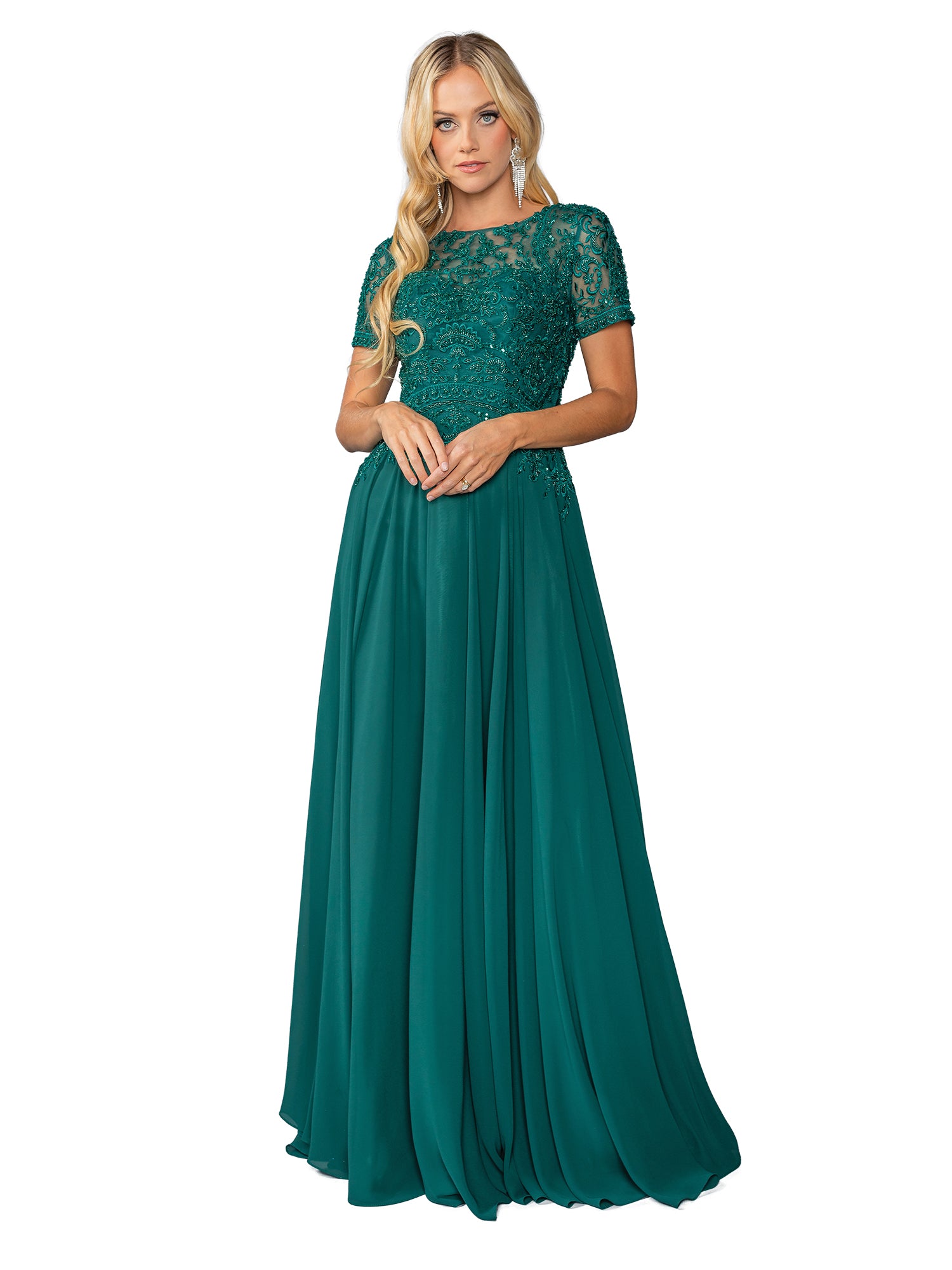 A woman in the Beaded-Bodice Long Prom Dress: Dancing Queen 4444, featuring a floor-length emerald green skirt and a beaded-lace bodice with short sleeves, stands against a white background.